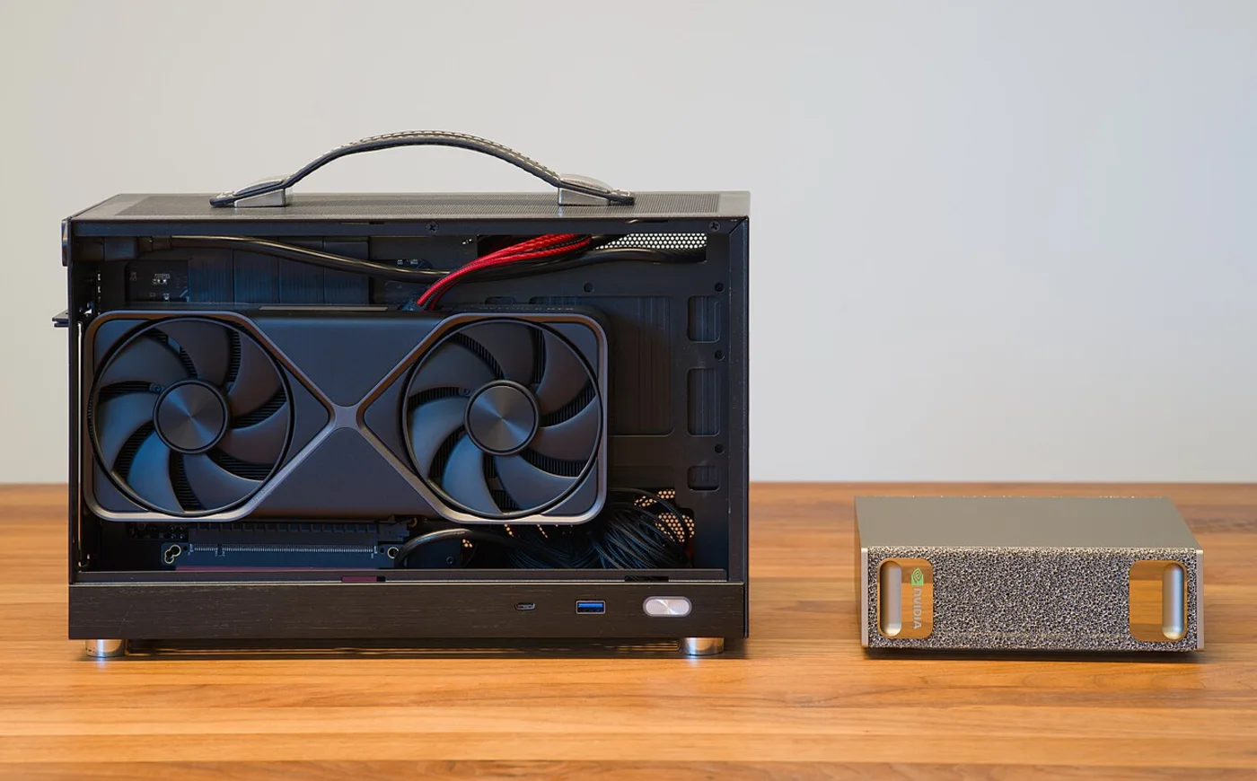 Small form factor PC build beside a compact desktop unit