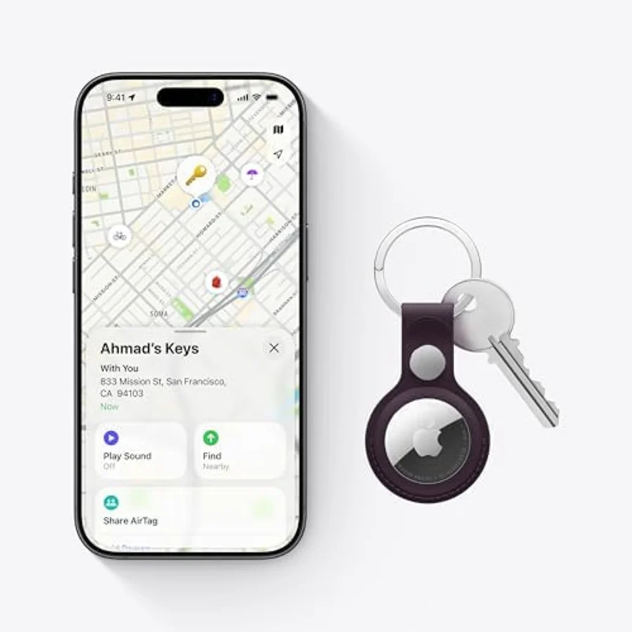 Apple AirTag, a small round tracker with a polished metal back and white face